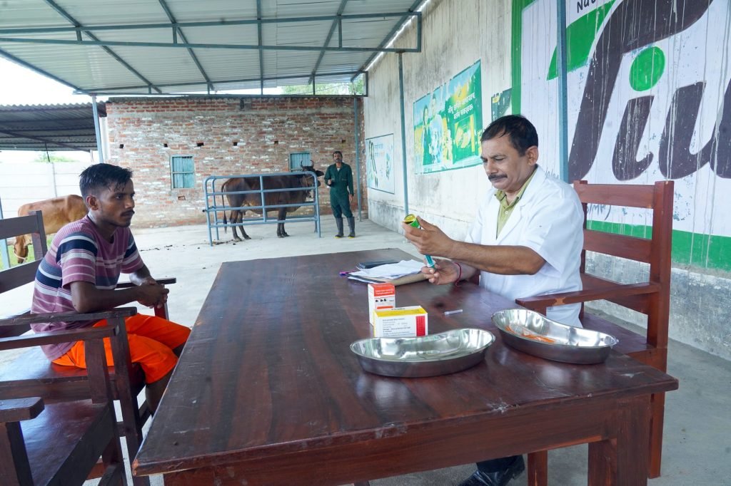 A veterinarian consulting a farmer